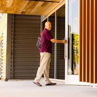 Man walking into commercial building